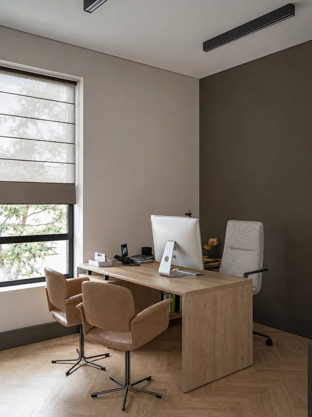 Private office with herringbone flooring
